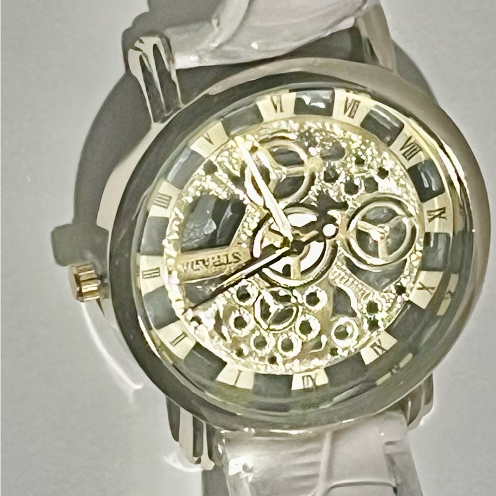 White leather strap skeleton watch